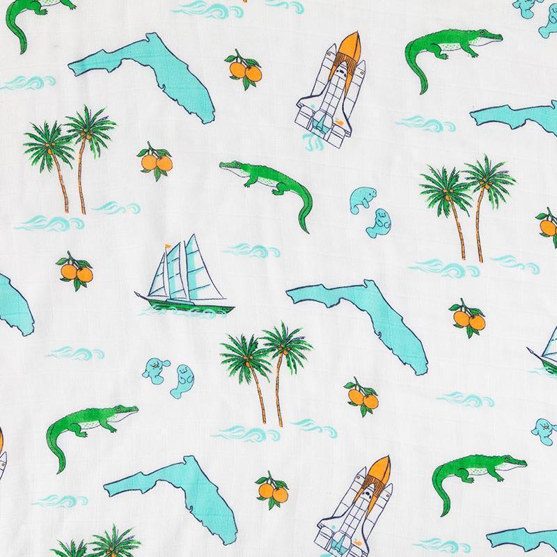 Florida-themed baby gift set with muslin swaddle blanket and burp cloth, featuring orange and palm tree prints.