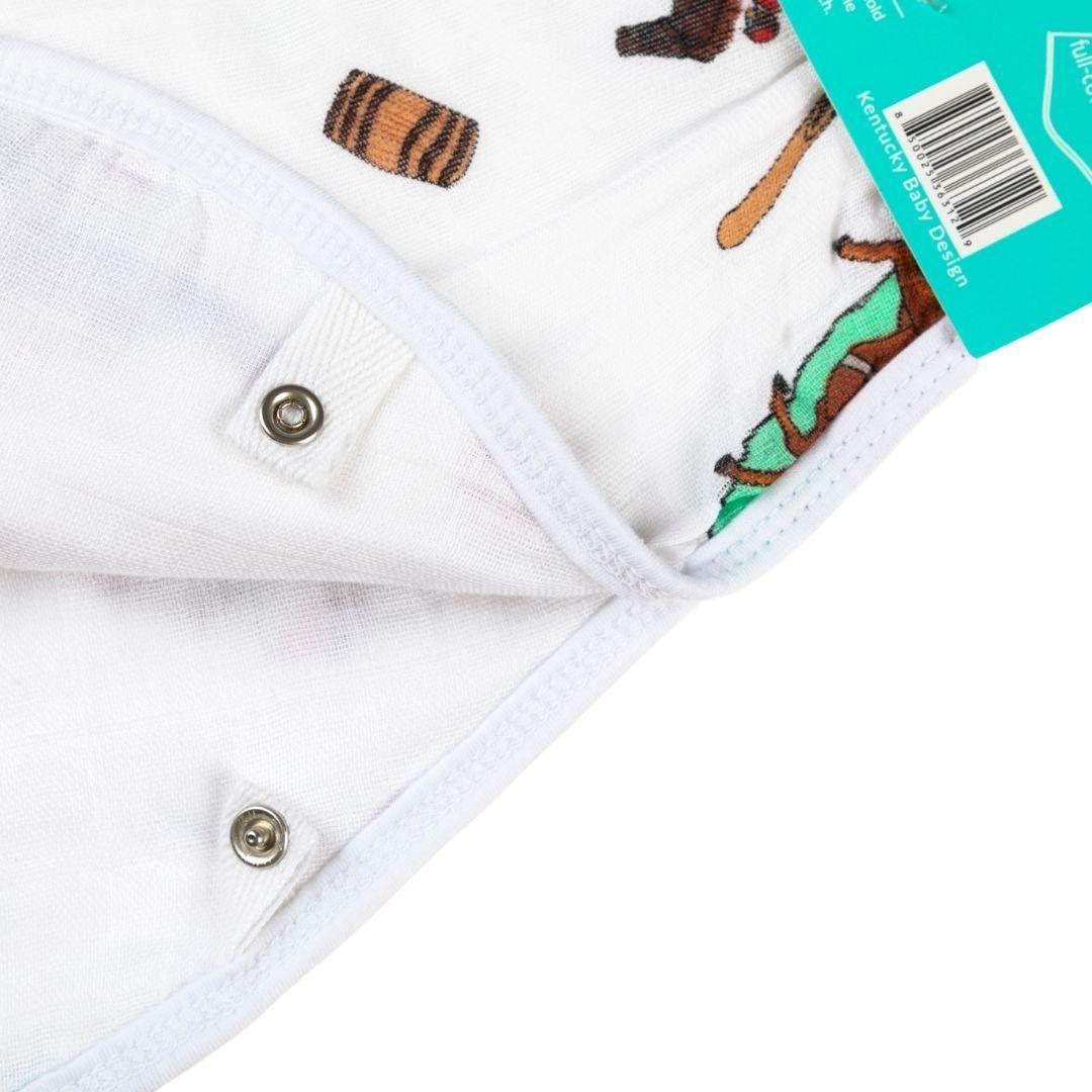 Kentucky-themed baby gift set with muslin swaddle blanket, burp cloth, and bib featuring state icons and landmarks.