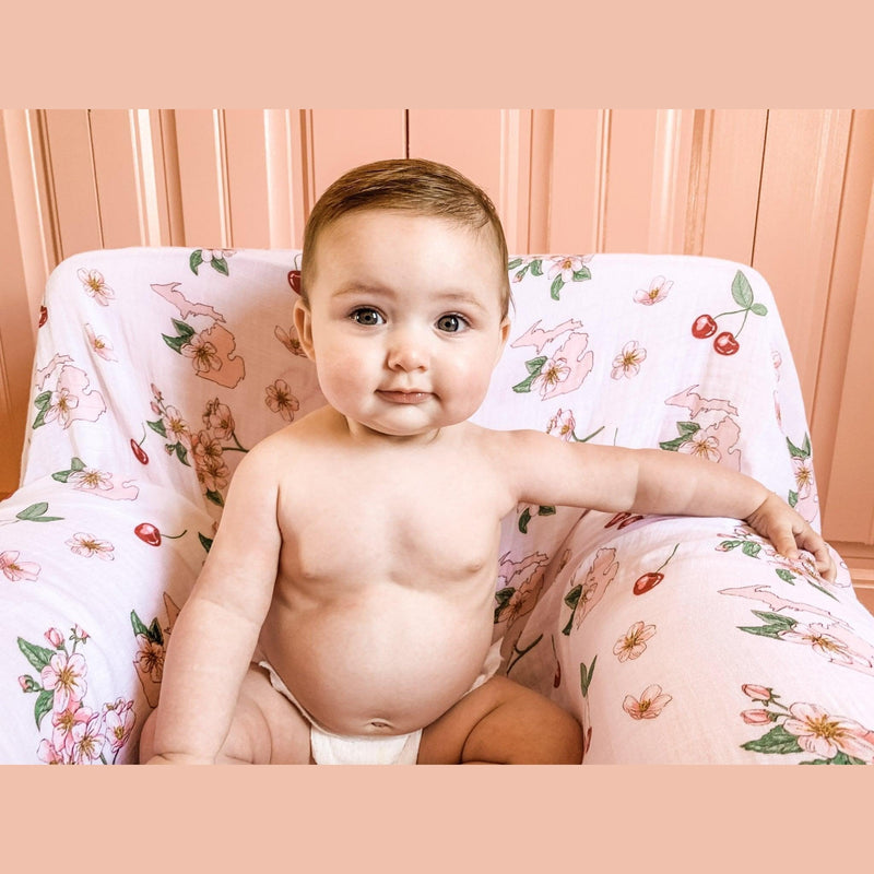 Michigan-themed baby gift set with floral muslin swaddle blanket and matching burp cloth/bib combo.