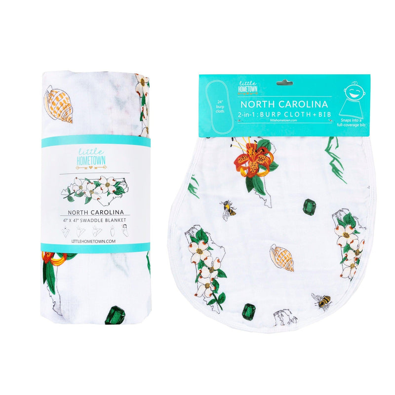 North Carolina-themed baby gift set with floral muslin swaddle blanket and matching burp cloth/bib combo.