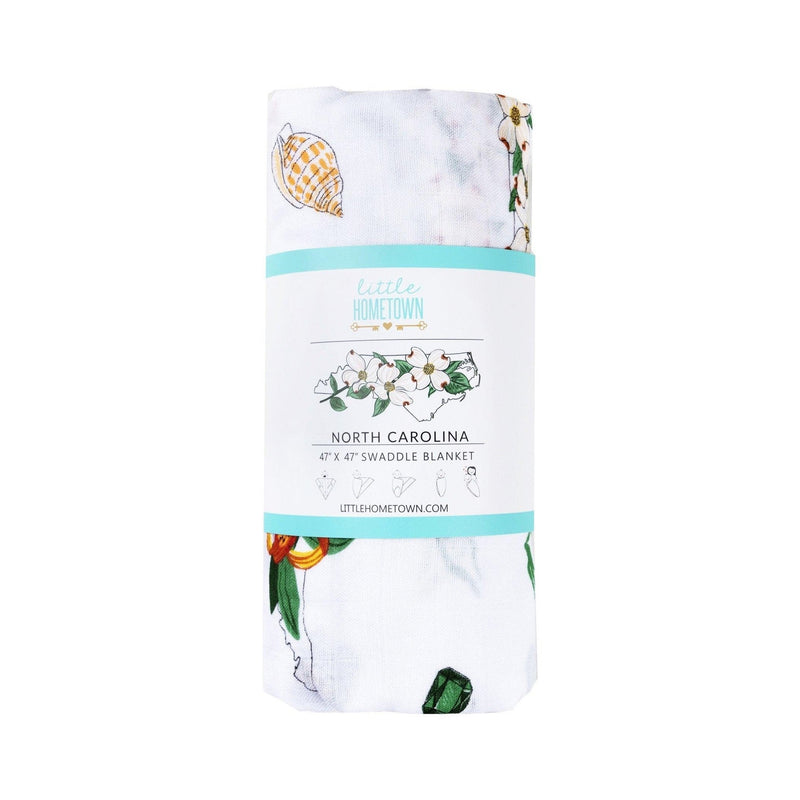 North Carolina-themed baby gift set with floral muslin swaddle blanket and matching burp cloth/bib combo.