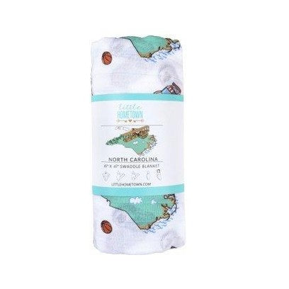 North Carolina-themed baby gift set with muslin swaddle blanket and burp cloth/bib combo, featuring state icons.