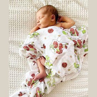 Ohio-themed baby gift set with floral muslin swaddle, receiving blanket, and burp bib, all in soft pastel colors.