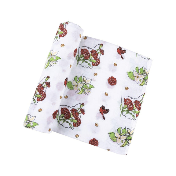 Ohio-themed baby gift set with floral muslin swaddle, receiving blanket, and burp bib, all neatly arranged.