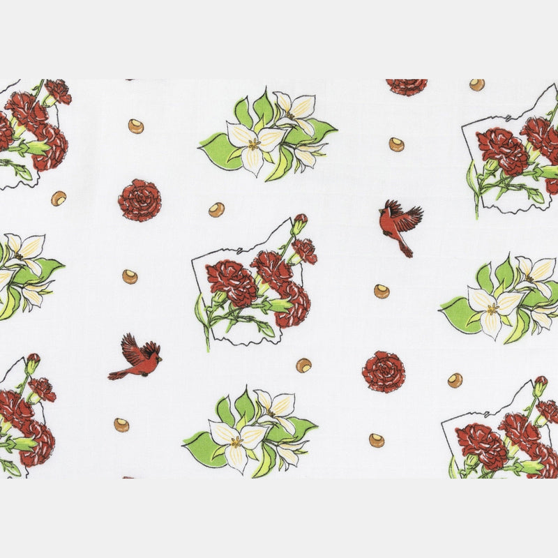 Ohio-themed baby gift set with floral muslin swaddle, receiving blanket, and burp bib, all neatly arranged.