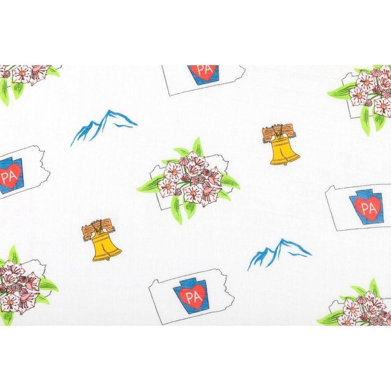 Pennsylvania-themed baby gift set with muslin swaddle blanket and burp cloth, featuring state icons and landmarks.