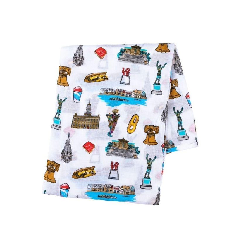 Philadelphia-themed baby gift set with muslin swaddle blanket and burp cloth, featuring iconic city landmarks.