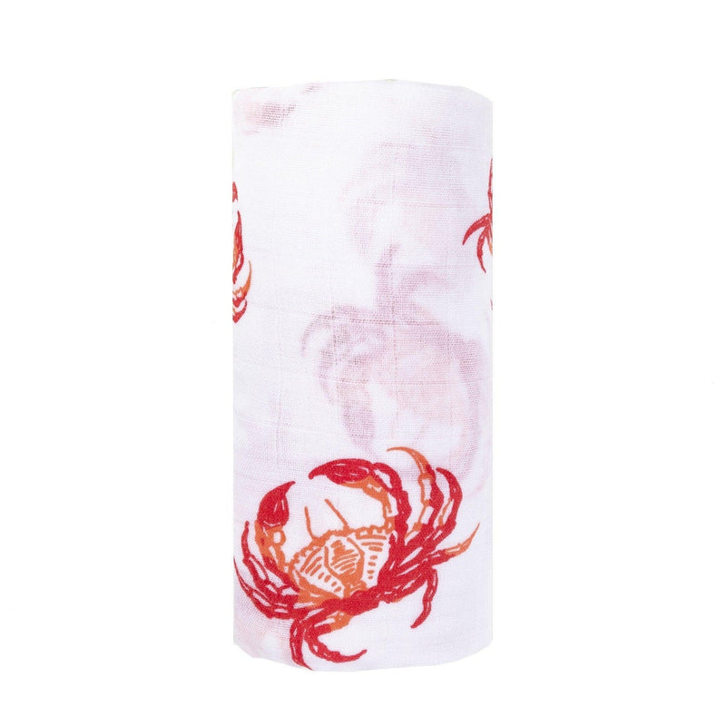 Pink crab-themed baby muslin swaddle blanket and burp cloth set, neatly folded on a white background.