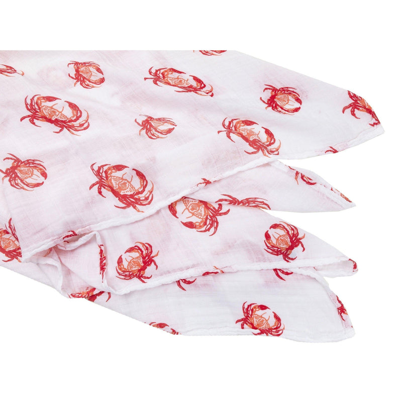 Pink crab-themed baby muslin swaddle blanket and burp cloth set, neatly folded on a white background.