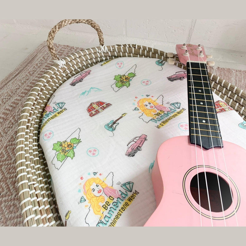 Tennessee-themed baby gift set with floral muslin swaddle blanket and matching burp cloth/bib combo.