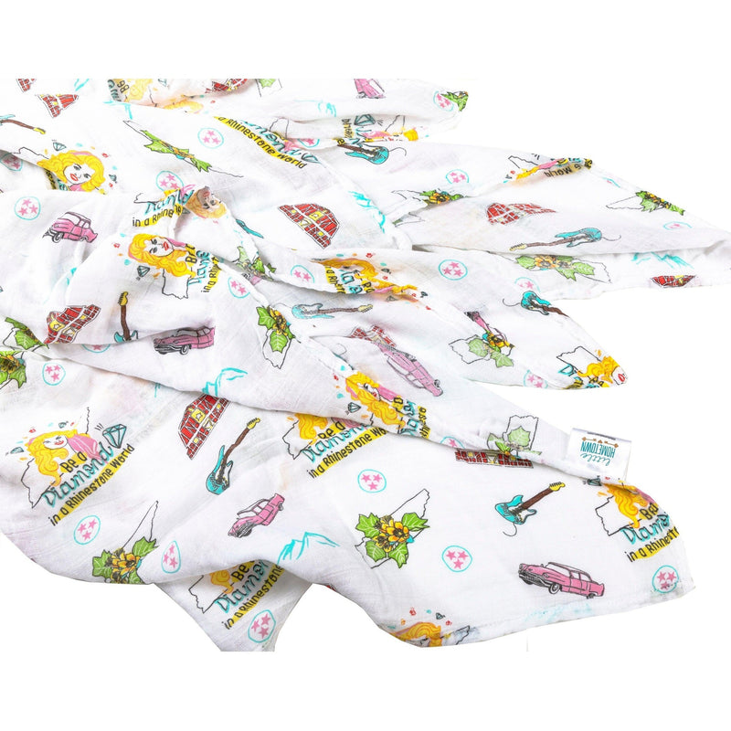 Floral-themed muslin swaddle blanket and burp cloth set with "Tennessee Baby" text, neatly folded on a white background.