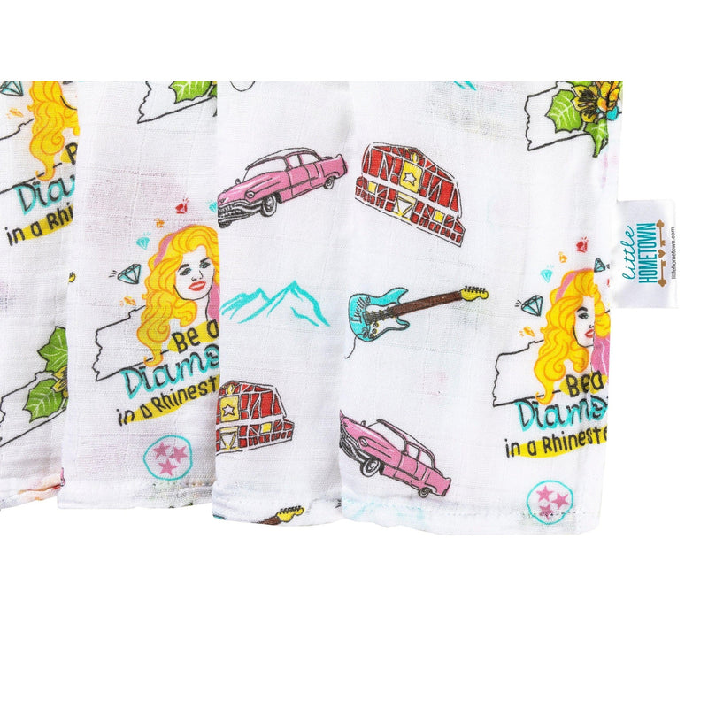 Tennessee-themed baby gift set with floral muslin swaddle blanket and matching burp cloth/bib combo.