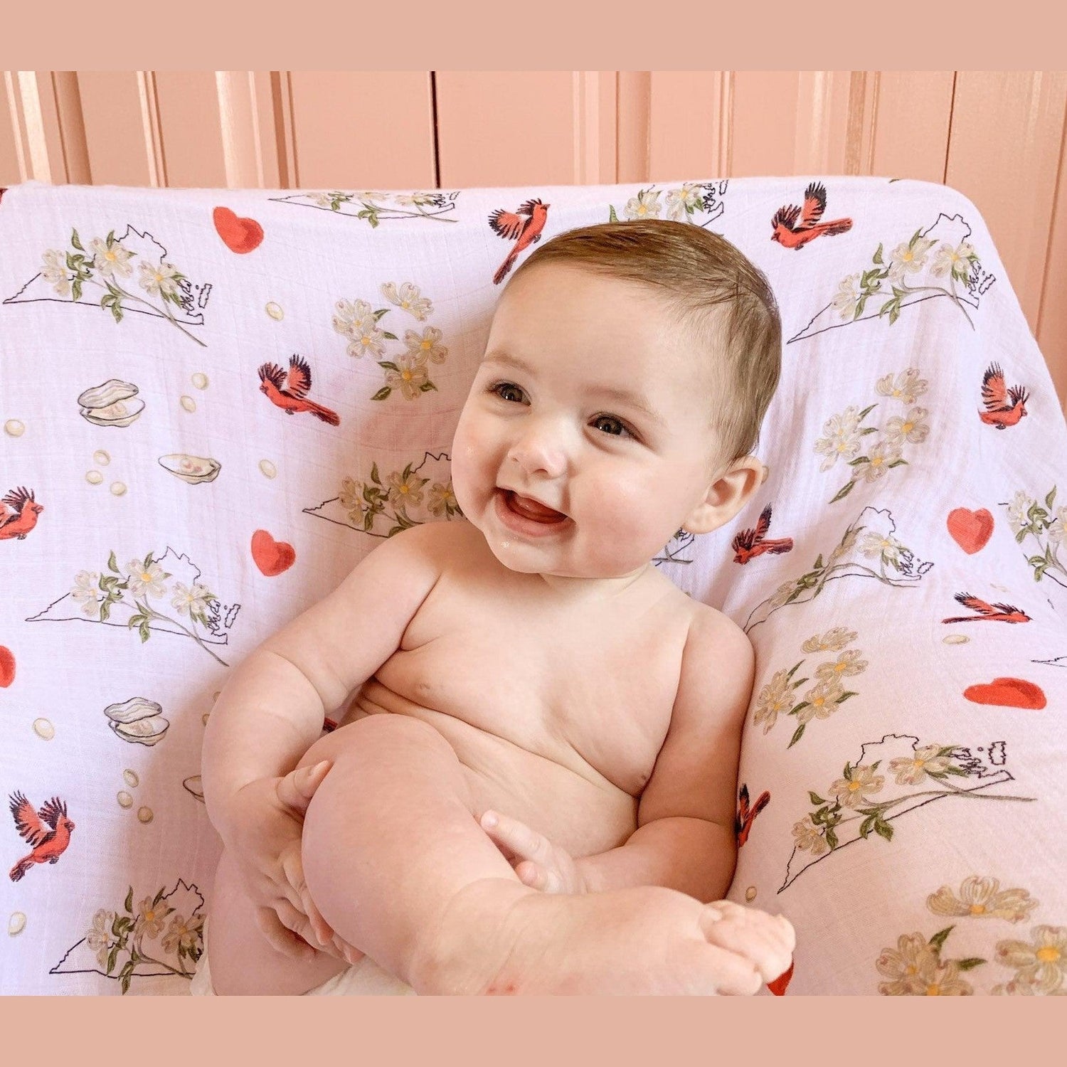 Floral-themed baby muslin swaddle blanket and burp cloth set, featuring delicate pink and green flower patterns.
