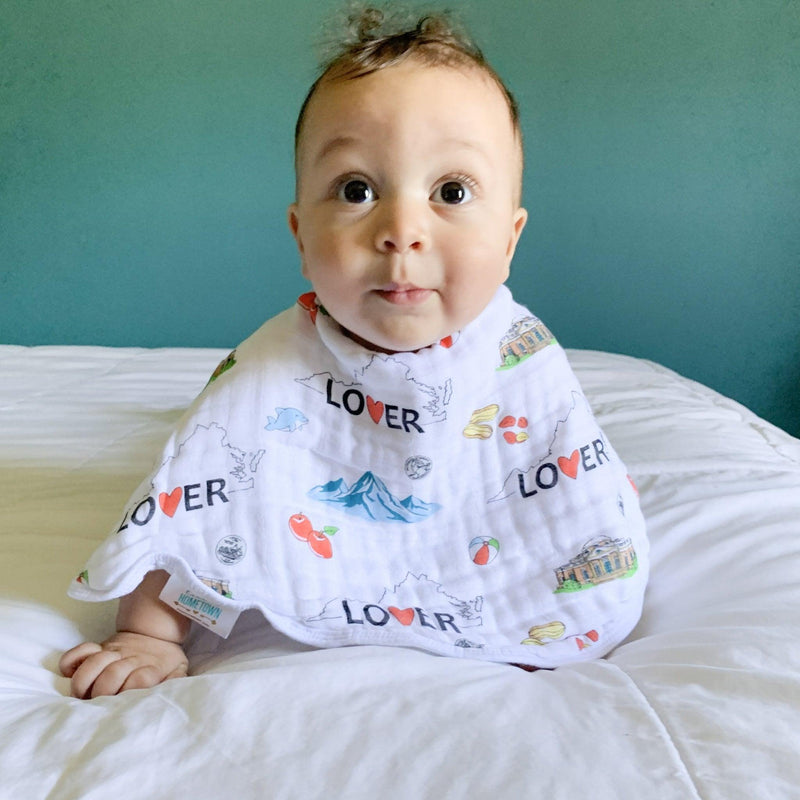 Virginia-themed baby muslin swaddle blanket and burp cloth set with state icons, in soft pastel colors.