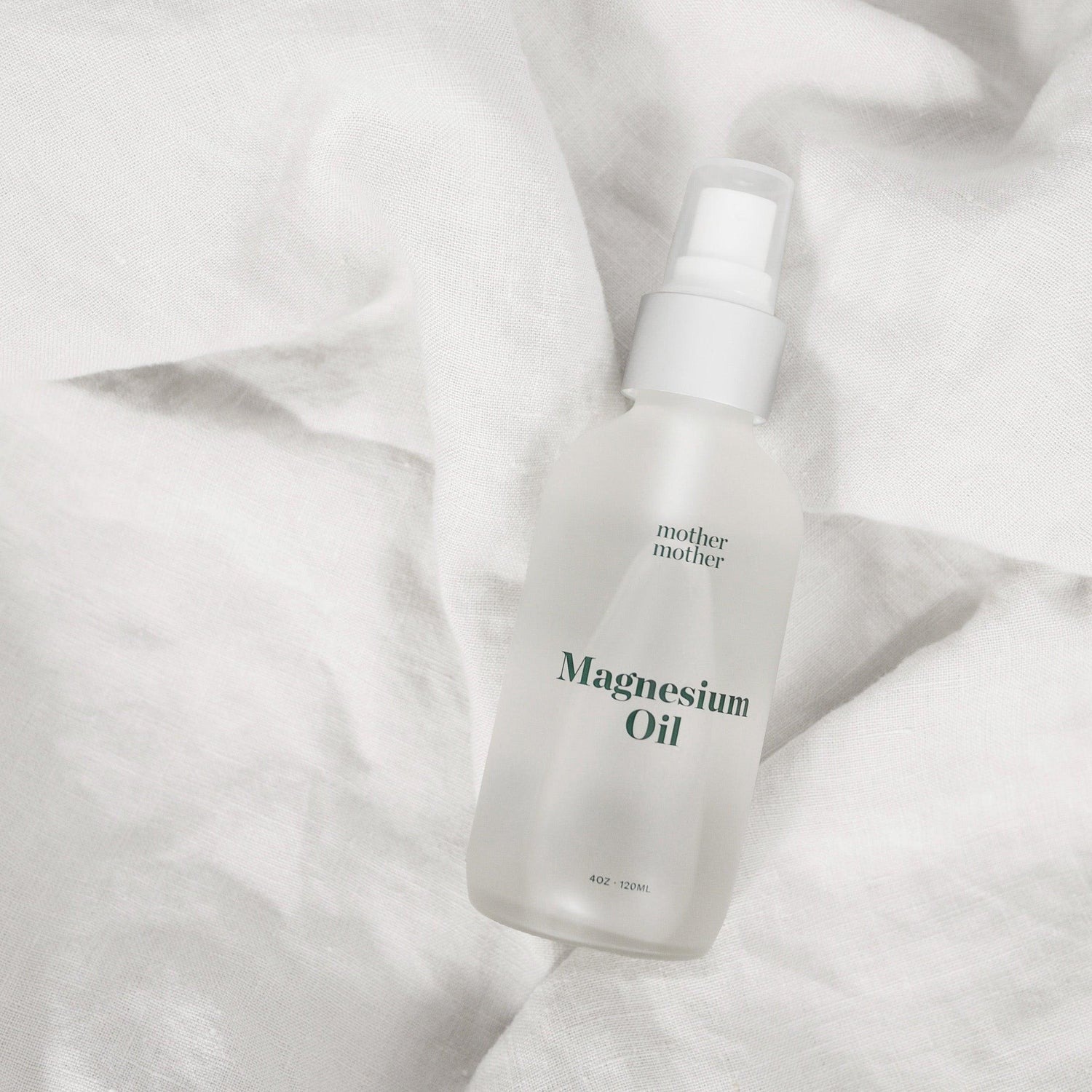 magnesium oil, essential pregnancy self-care on linen