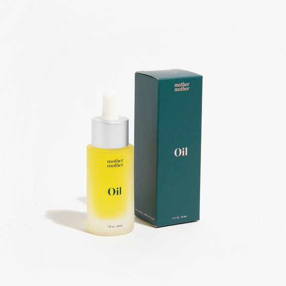 Mother Mother Face & Body Oil next to a green box on a white background