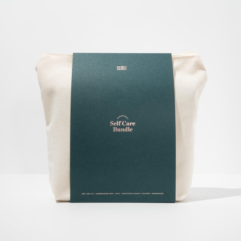 pregnancy and postpartum self care bundle in canvas bag on a white background