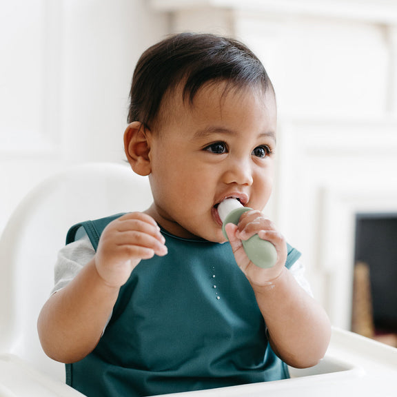 Pre-feeding set by ezpz in sage green includes the tiny pops and oral development tools (silicone teethers) #color_sage